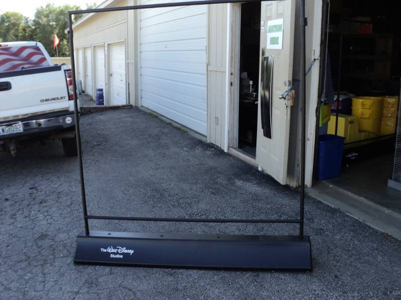 lot 2640 image: (1) Walt Disney Studios  banner frame, adjustable height