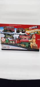 lot 66751 image: 22 Piece North Pole Train Set with Lights and Sound - Retail $25
