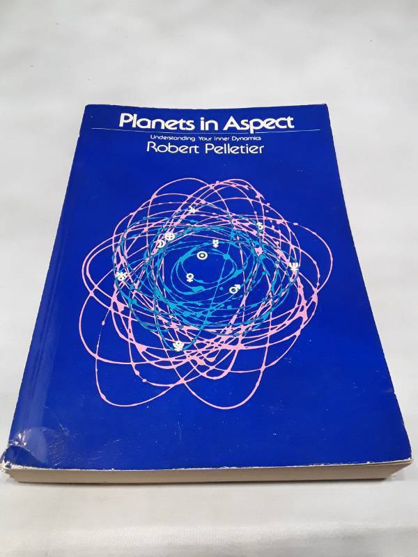 lot 11048 image: Planets in Aspect by Robert Pelletier - 1974 Astrology Guide, back cover ripped