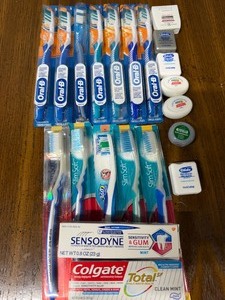 lot 74 image: Toothbrushes, Toothpaste and Floss