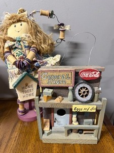 lot 915 image: Girl and CocaCola Birdhouse Decor
