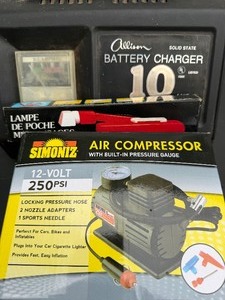 lot 409 image: Battery Charger, Air Compressor, Mini Light and a Funnel