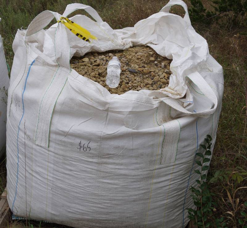 lot 5124 image: Partial bag of Tan Crushed Limestone base  - Landscaping Rocks - Bid now to git er done