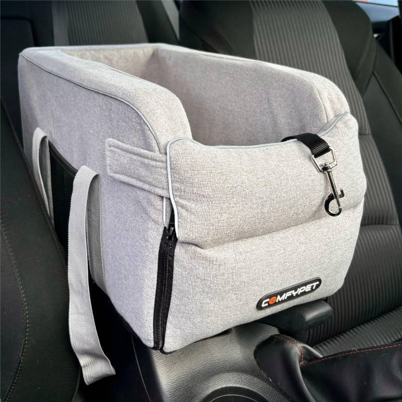lot 1036 image: COMFYPET Car Seat for Small Dogs Under 12 lbs. Sturdy, Safe, Washable Center Console Dog Car Seat with Bottom Board and Three Straps for Stability, Adjustable Leash for Safety (Grey) - Retail $20