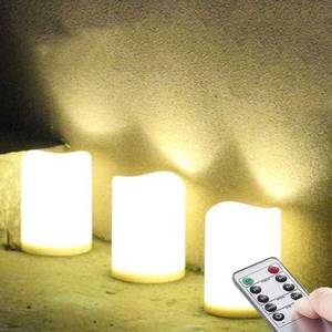 lot 1229 image: Set of 3 Outdoor IP44 Warm White LED Rainproof Waterproof Flameless Battery LED Pillar Candles with Remote and Timer, Plastic, Wont Melt, Weather Resistant Design 3 x 4, Timer 24hours - Retail $16