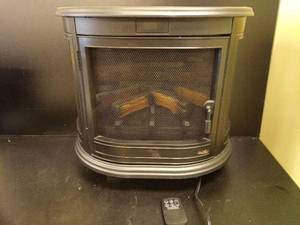 lot 1293 image: 25 inch Electric Fireplace Heater Fireplace Stove Portable Freestanding Fireplace Heater for Indoor Use Powers On - Retail $140