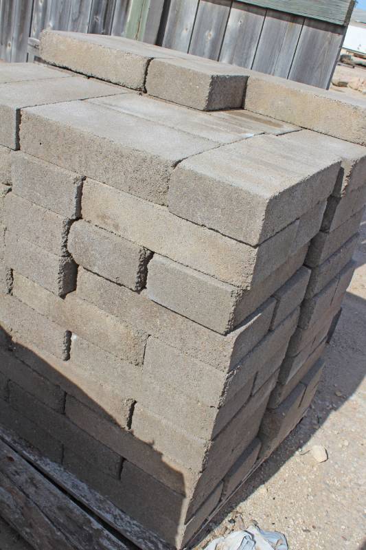 lot 1427 image: Lot of104 Pieces of 8 x 8 x 16 Solid Split Face - Buyer will need to hand load as pallet is bad