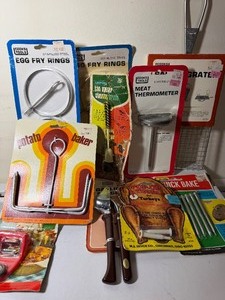 lot 105 image: Vintage Kitchen Helpers - Egg Fry Rings, Garlic Press AND MORE in a Basket