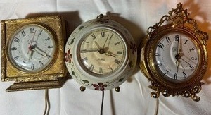 lot 274 image: Vintage Alarm Clocks (one has damage on back)