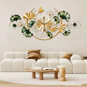 lot 441776 image: Retails for $110 Large Wall Clock for Living Room, 3D 47 Inch Metal Ginkgo Leaf Wall Decor, Boho Silent Non-Ticking Hanging Wall Clocks, Decorative Big Wall Clock, for Bedroom Dining Room Office (47.2X20.9In)