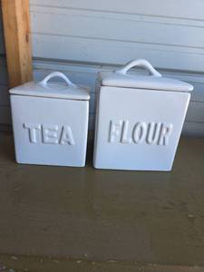 lot 34 image: White Ceramic Kitchen Canisters- Tea and Flour