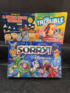lot 239 image: Family Board Game Bundle - Charlie Brown, Trouble, Disney Sorry