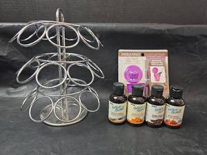 lot 402 image: Wire Pod Rack, Reusable Filter Cup, and Partial Bottles of Better Stevia Liquid Sweeteners