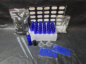 lot 409 image: Essential Oil Bottle Kit with Blue Glass Bottles and Accessories