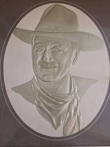 lot 440 image: John Wayne Cowboy Portrait Relief Plaque
