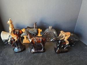 lot 450 image: Avon Western Themed Glass Cologne Bottle Collection