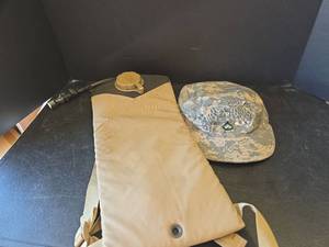 lot 556 image: Military Camelbak Hydration System (new) with  Camouflage Patrol Cap Size 7 38