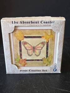 lot 600 image: AbsorbaStone Butterfly Design Four Piece Coaster Set