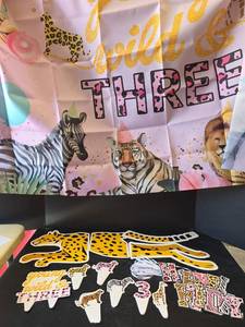 lot 678 image: Young Wild and Three Safari Party Banner and Decorations