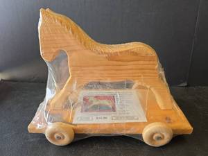 lot 774 image: Paint Your Own Wooden Horse Pull Toy