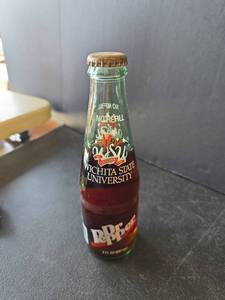 lot 778 image: Dr Pepper Wichita State University Centennial Commemorative Bottle 1895-1995