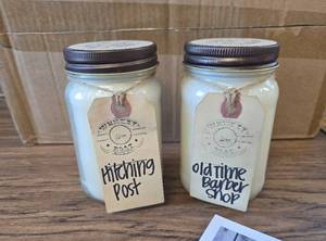 lot 6996 image: 2-Pack Whiskey Boat Candles, Hitching Post & Barber Shop, 16oz