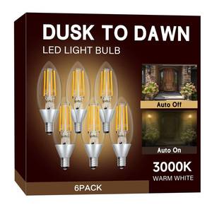 lot 2207 image: UNILAMP Dusk to Dawn LED Outdoor Light Bulb, Candelabra Light Bulbs Outdoor, 5W Equivalent 40W, 3000K Warm White, 500LM, Edison E12 Base B11, Photocell Sensor for Porch Sconces Patio Garage, 6 Pack