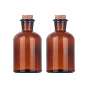 lot 8376 image: Magic Season Decorative Round Glass Bottles with Cork Stoppers (2 PcsAmber  4 fl oz.)