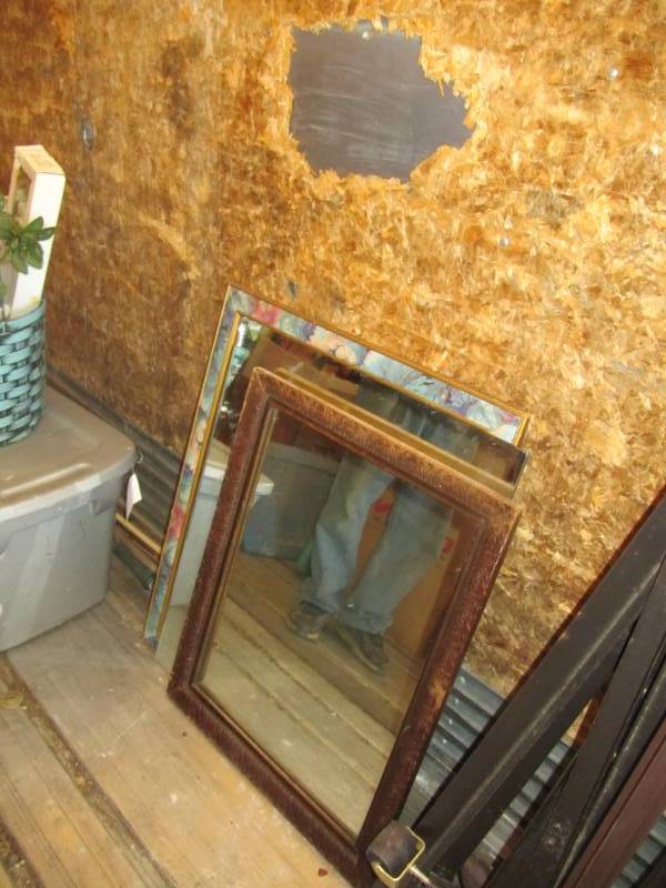 lot 276 image: 3 mirrors-largest mirror is 25.5wide 32tall in multi-color frame smallest mirror is 24Wide 26Tall in wood frame the third mirror does not have frame