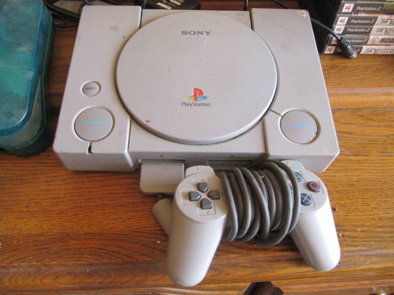 lot 310 image: Play Station 1 console and controller