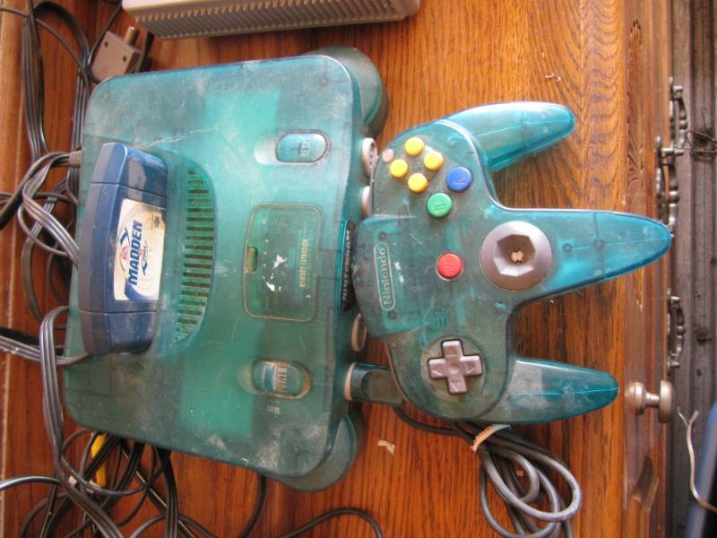 lot 311 image: 2 Nintendo 64 consoles,  2 controllers and  2  games