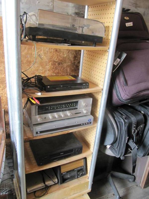 lot 315 image: Contents of shelf ONLY  contents are record player, 3 DVD players, Tuner,   VHS player  and air cleaner
