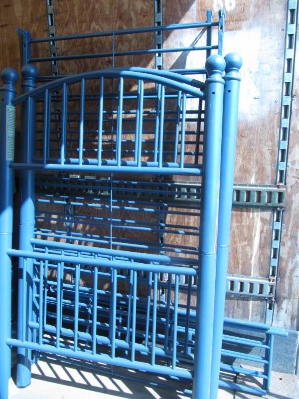 lot 318 image: Blue metal twin size bunkbeds with frame,  side rails and ladder excellant condition