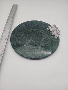 lot 55536 image: Green Marble Trivet with Silver Grape Design