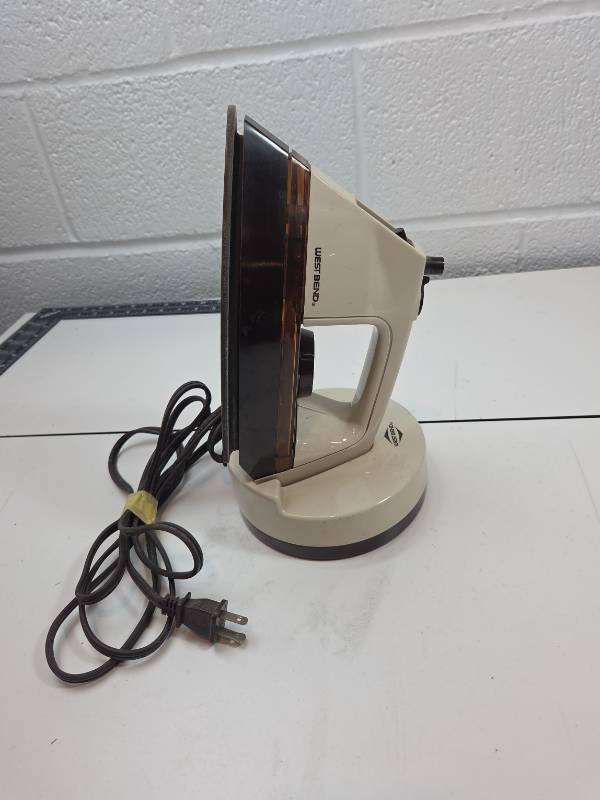 lot 111 image: Westbend Electric Iron with Stand