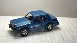 lot 0100 image: Tootsietoy Plymouth Reliant K Car