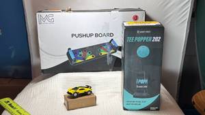 lot 0134 image: Bandit Sports Tee Popper 202 Push-up Board with Model Car