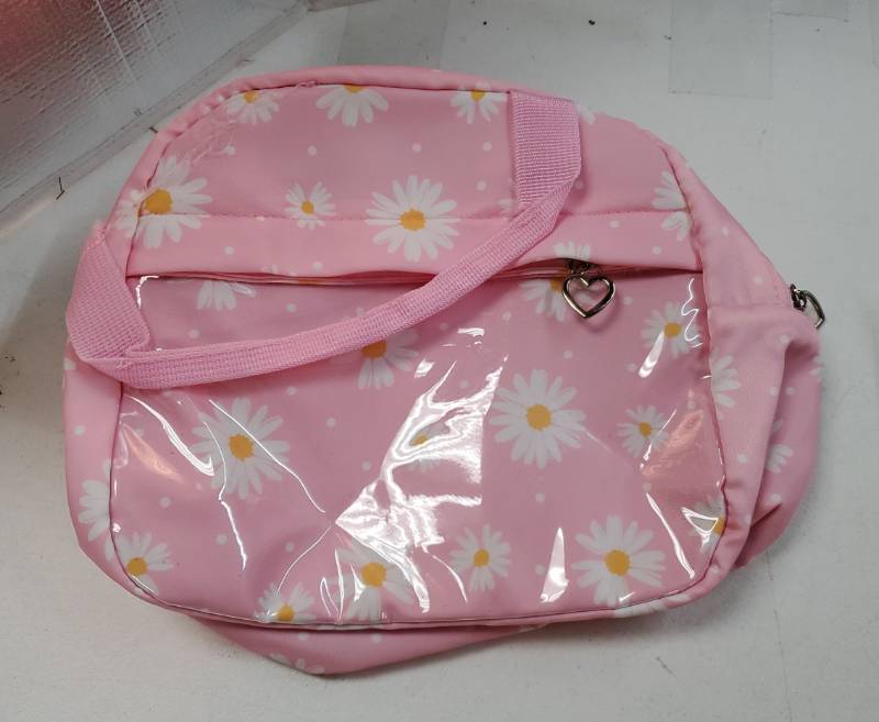 lot 53908 image: Backpack for Girls - Girls Backpack with Lunch Bag & Pencil Pouch for Teen Kids Laptop Backpack for Women, Elementary Middle High School Bookbag Travel Daypack (Pink Daisy). THERE IS A NAME WRITTEN INSIDE.