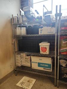 lot 17805 image: Storage Shelf Unit W Restaurant Supplies Including Disposable Containers, Latex Gloves, and More