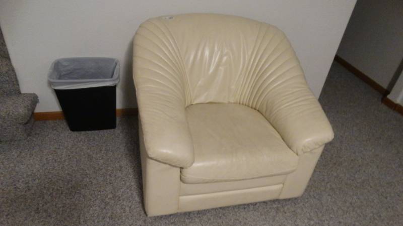 lot 1765 image: Creme colored leather chair.