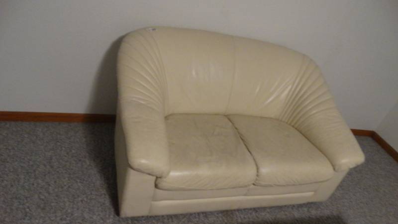 lot 1766 image: Creme colored leather couch.