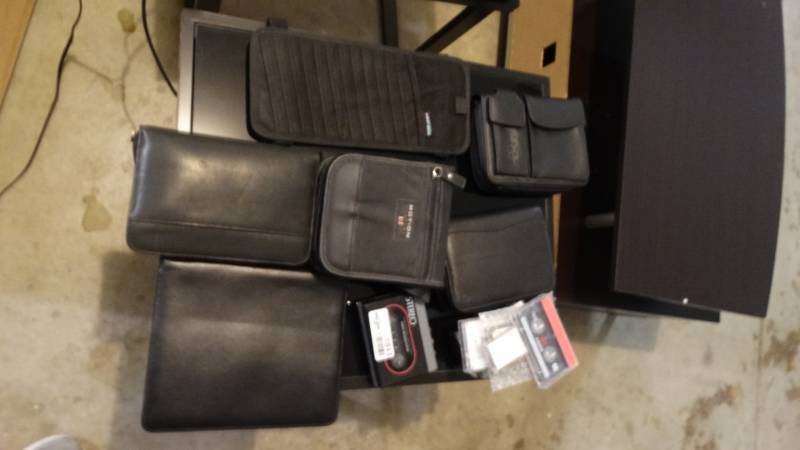 lot 1843 image: Lot of cd holders, tapes, monthly planner.