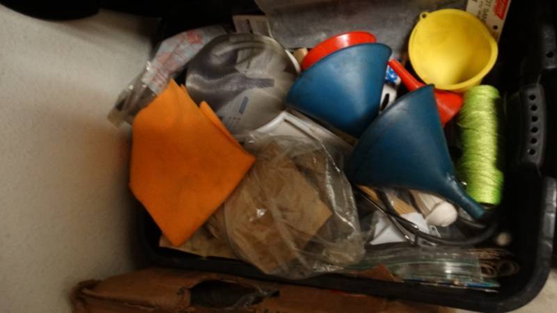 lot 1872 image: Tub full of string, oil funnels, assorted sand paper, googles, sander and much more.