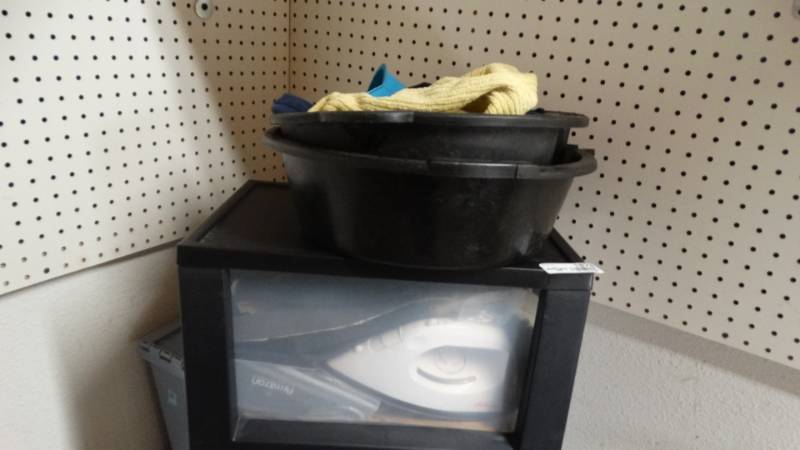 lot 1878 image: 2 8 Quart Oil pans, plastic container with drawer with iron and miscellaneous items inside.