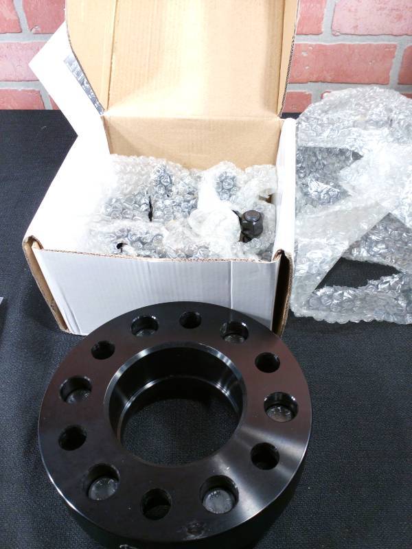 lot 82 image: Coyote Billet Aluminum Wheel Adaptors W Lug Nuts