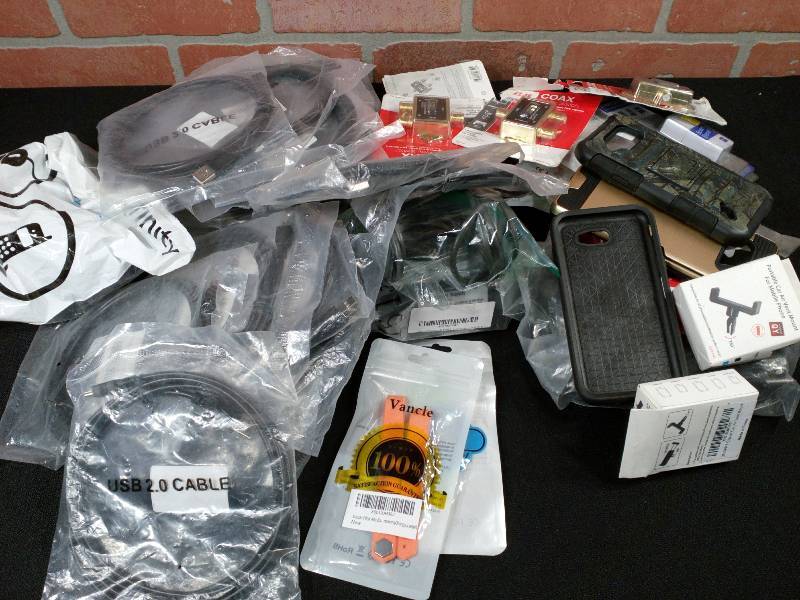 lot 122 image: Electronics Cords Cellphone Covers and More