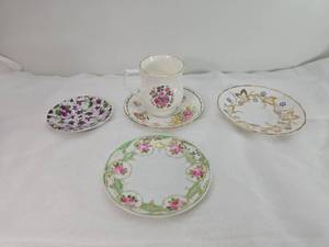 lot 57 image: Decorative Tea Cup and Saucer Set with mis-Matched Plates