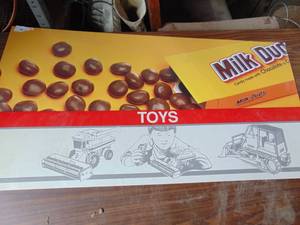 lot 1883 image: Milk Duds and Toys plastic signs
