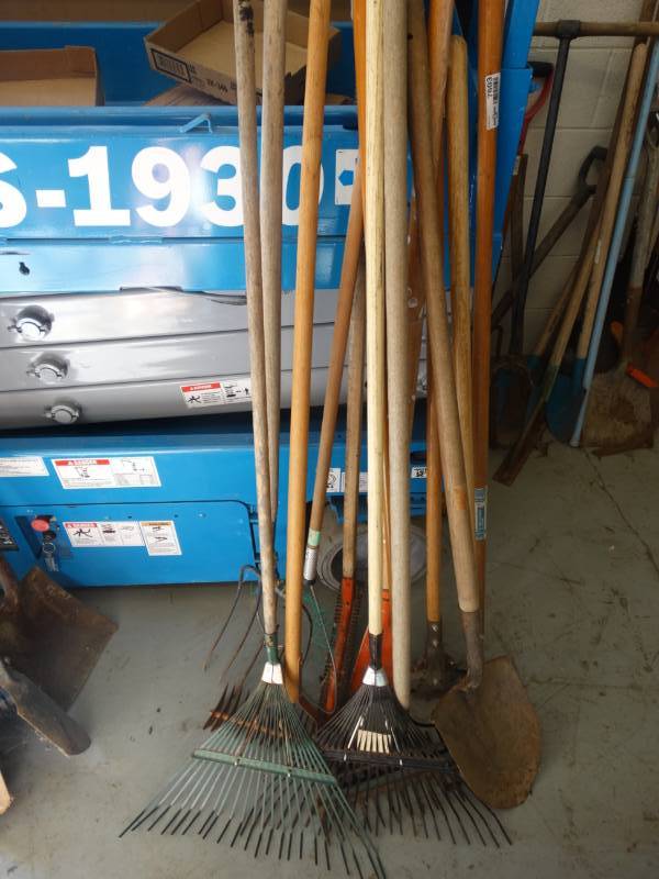 lot 7603 image: Large lot of long handle yard tools.