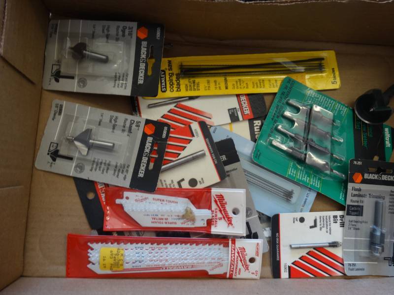 lot 7616 image: Lot of saber saw blades, 316 ogee, 38 glass & tile drill bit, 12 cove, & more.